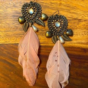 Feather statement earrings